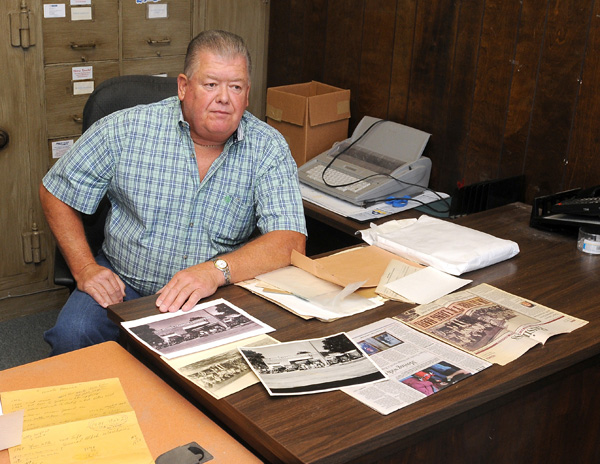 David Kennan talks Friday about his family’s 108-year-old business, Rogers Transfer & Storage. Kennan was speaking in the business’ office at the corner of East Chestnut and North Arkansas streets in Rogers. The business entered bankruptcy in August because of the overall sluggish economy.