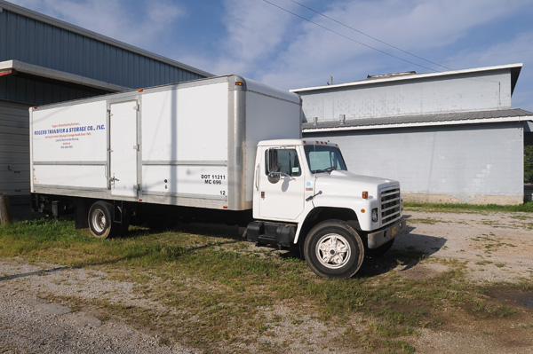 The advertisement on the side of the moving van calls Rogers Transfer & Storage the city's oldest existing business. The company entered bankruptcy in August because of a slow economy, according to third generation owner David Kennan.