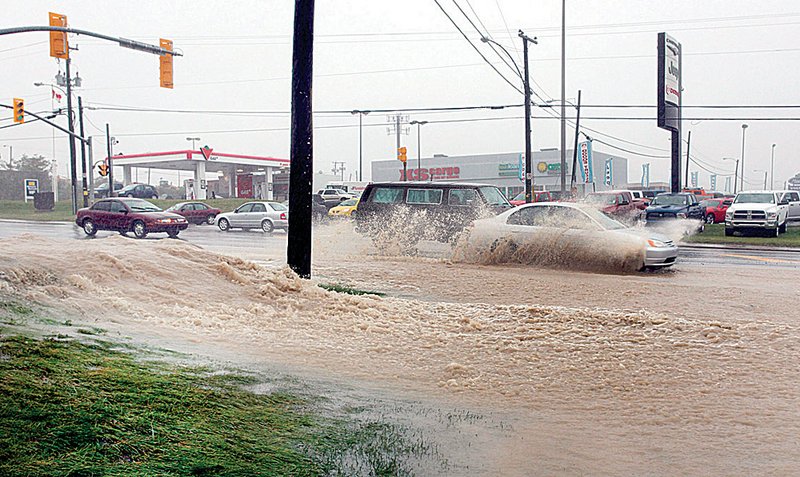 Storm drains were unable to contain the heavy rains from Hurricane Igor as it hit St.John’s, Canada, on Tuesday.