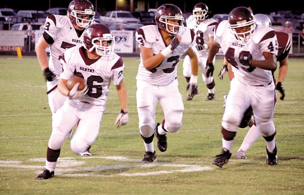 With plenty of support, junior Tanner Coy carries the ball downfield to pick up some yards for the Gentry Pioneer team in its game against Siloam Springs on Friday night.
