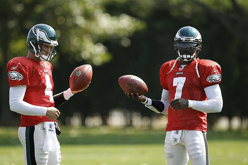 Philadelphia Eagles quarterbacks Michael Vick (7) and Kevin Kolb are seen during practice Wednesday. The Eagles are one of nine teams who have already used their backup quarterback this season.