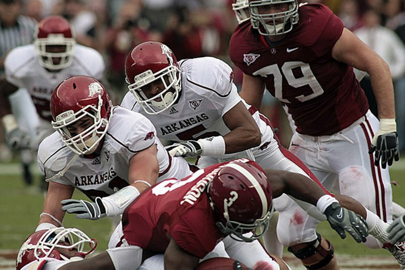 A 52-yard touchdown run by Alabam’s Trent Richardson (3, above) and a 17-of-24 passing effort by quarterback Greg McElroy (right) were two of the reasons Arkansas left Tuscaloosa, Ala., on the short end of a 35-7 score in 2009. The Arkansas defense was able to hold eventual Heisman Trophy winner Mark Ingram to 50 yards on 17 carries.