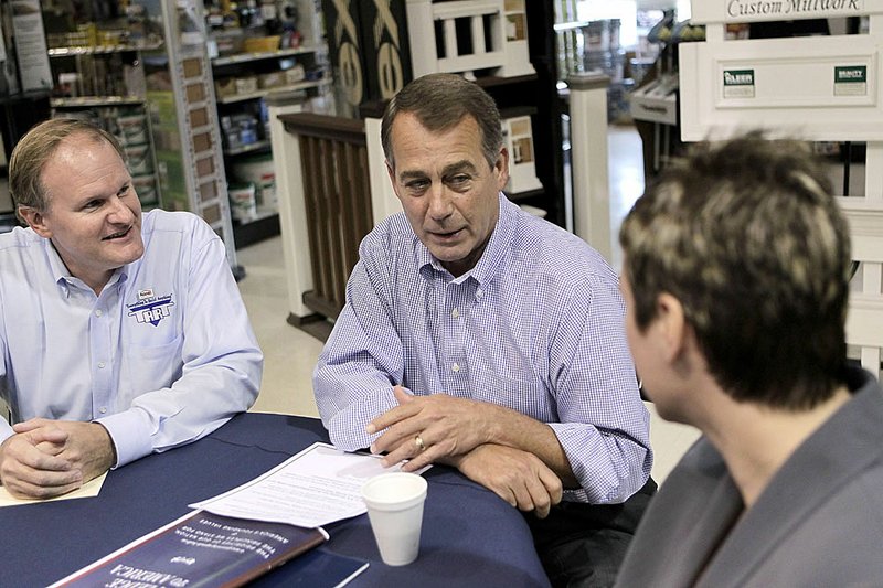 House Minority Leader John Boehner of Ohio (center) accompanied by Tart Lumber President Craig Fritsche (left) and Tabetha A. Baume-Chandler, president of Facility Technology of Sterling, Va., discusses the Pledge to America agenda Thursday at Tart Lumber in Sterling, Va.