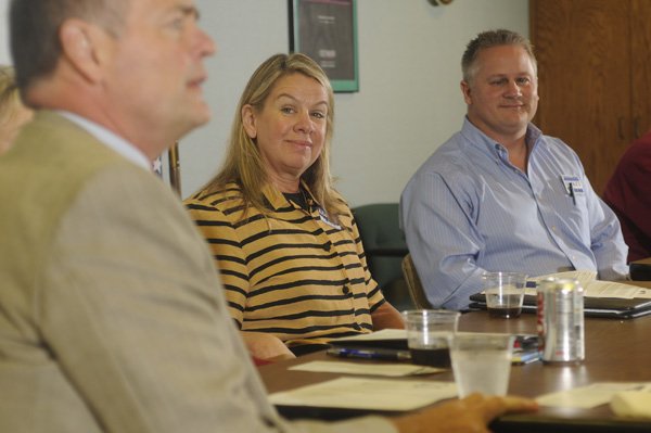 Jeff Dickey, right, and Rhonda Adams, both candidates for Ward 4 Position 1 on Fayetteville City Council listen Friday to city attorney Kit Williams during a candidate forum.
