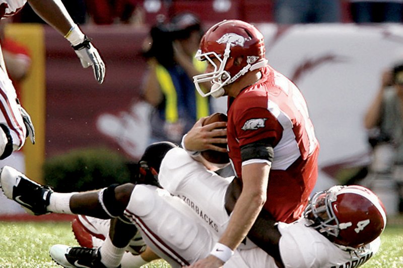 UA’s Ryan Mallett is sacked in the third quarter of a heartbreaking game for the Hogs and their fans Saturday afternoon in Fayetteville. 