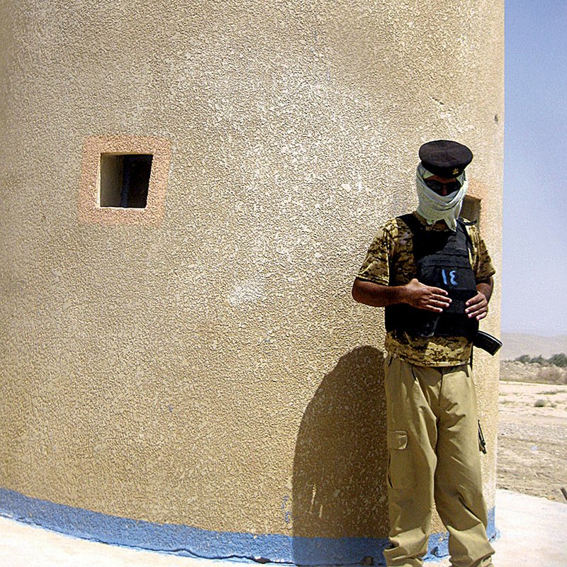 An Iraqi border policeman stands watch at a fort near Zurbatiyah along the ill-defined border with Iran.