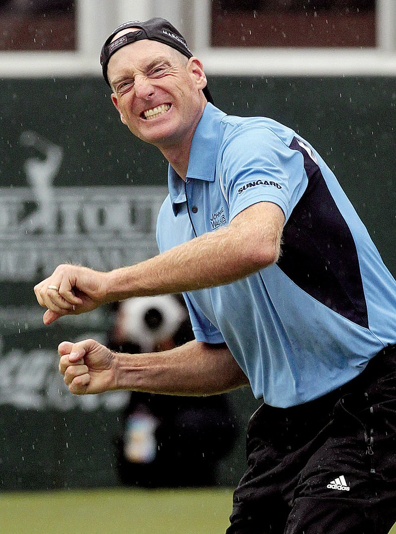 Golfer Jim Furyk lets loose after sinking a 2 /2-foot par putt to win the Tour Championship and capture the FedEx Cup title on Sunday at East Lake Golf Club in Atlanta.