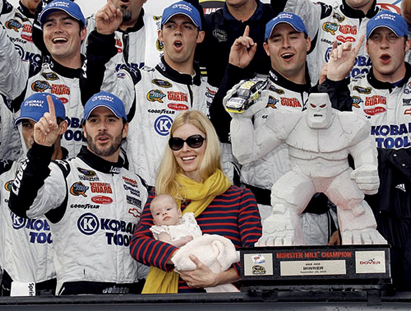NASCAR driver Jimmie Johnson took a big step toward winning his fifth consecutive Sprint Cup title, winning Sunday’s race at Dover International Speedway in Dover, Del.