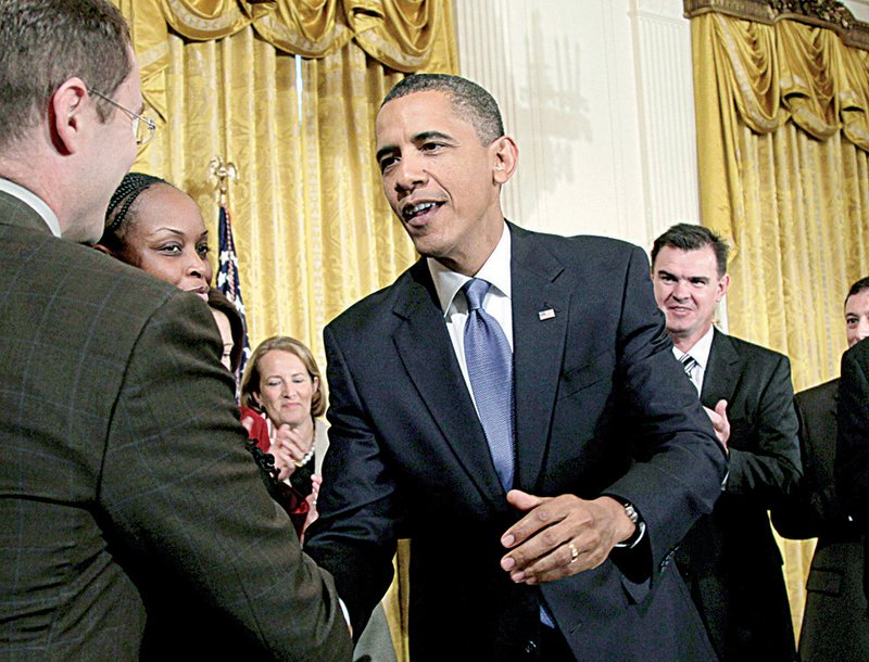 President Obama shakes hands in the East Room of the White House in Washington on Monday.