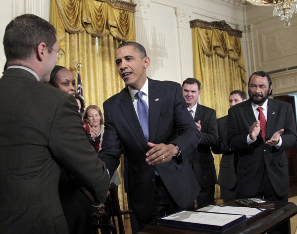 President Barack Obama shakes hands in the East Room of the White House in Washington, Monday, Sept. 27, 2010, during a ceremony to sign the Small Business Jobs Act. The $42 billion measure passed by Congress takes effect immediately and is designed to aid small businesses and create jobs. 