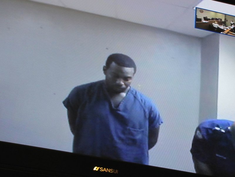 Jeremy Farr, 23, appears on a video screen from the Pulaski County jail during arraignment Monday morning in Little Rock District Court.