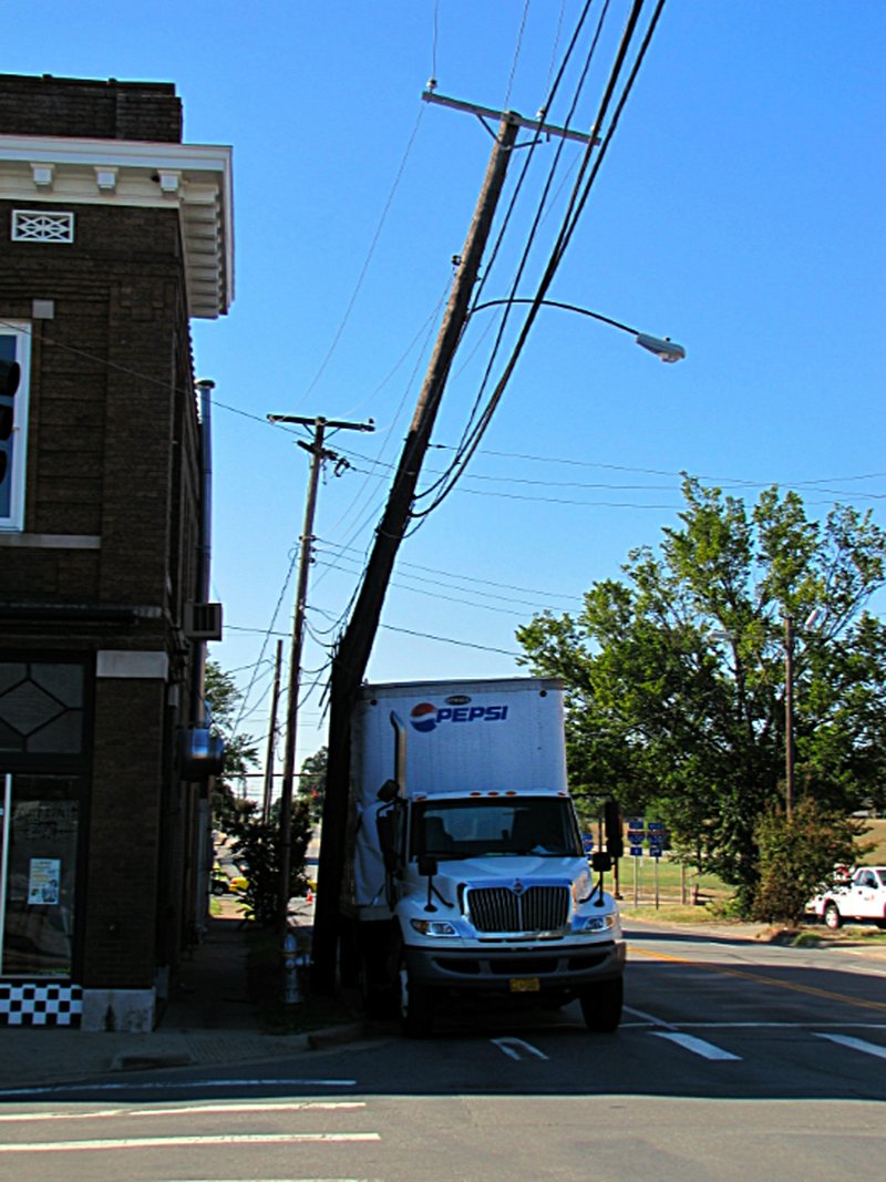 A truck hit the power pole near Vino's on 7th Street, temporarily knocking out power to the block.