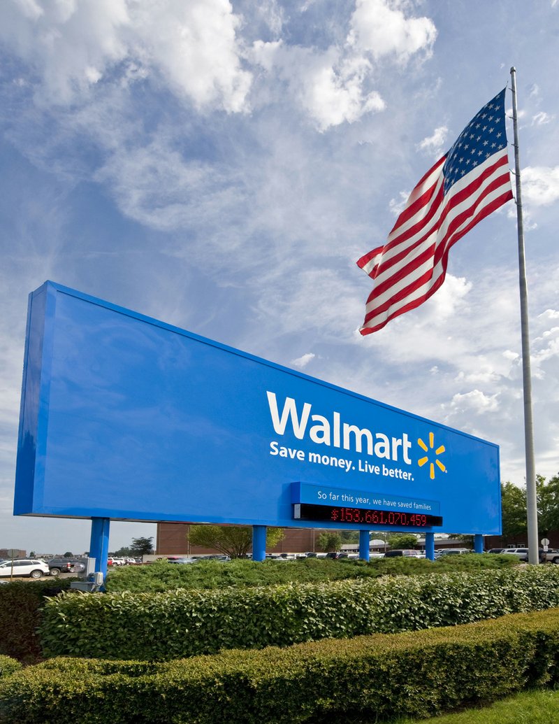 This undated file photo provided by Wal-Mart Stores Inc., shows the company's sign in front of their Bentonville, Ark., headquarters.