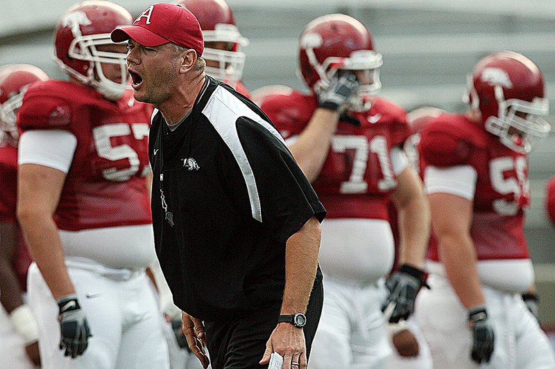 Arkansas strength and conditioning coach Jason Veltkamp (above), shown during practice last month, was part of a freshman class of 30 players and among only five or six to finish as seniors while playing for Bob Petrino, Sr. at Carroll College in Montana.