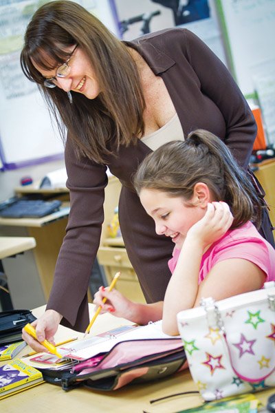 Kathy Powers helps Carlie Cowgill with her reading homework during a study-hall class. Powers began her teaching career in Chapel Hill, N.C., and moved to Conway when her husband accepted a position at the University of Central Arkansas. She has been teaching in the Conway Public Schools since 1998. Powers was named Teacher of the Year at Ray and Phyllis Simon Intermediate School. She will attend the second annual Arkansas Teacher of the Year Gala on Friday, Nov. 12.