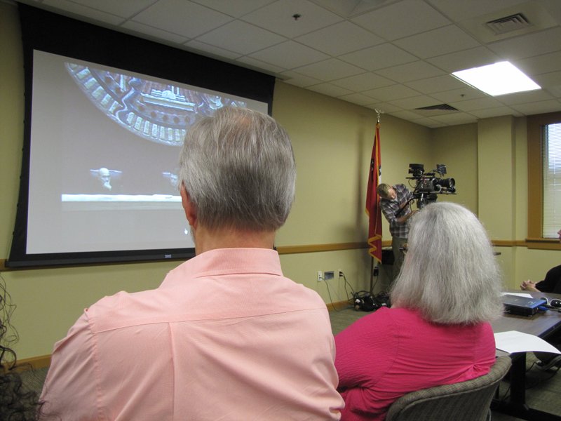 Spectators watch the Arkansas Supreme Court oral arguments in the Damien Echols appeal from a live video streamed to a nearby room.