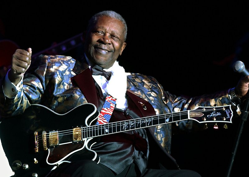 Blues guitarist B.B. King smiles to the crowd at the Lowell Memorial Auditorium, in this Jan. 5, 2005, file photo, in Lowell, Mass. 