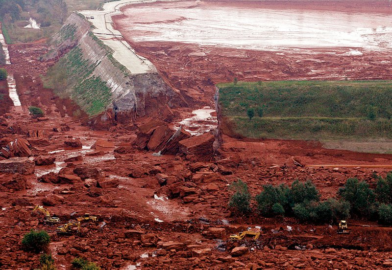 An aerial photo taken Tuesday, Oct. 5, 2010, shows the ruptured wall of a red sludge reservoir of the Ajkai Timfoldgyar plant in Kolontar, 100 miles (160 kilometers) southwest of Budapest, Hungary. 