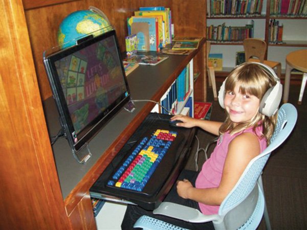  Katrina Nelson, 7, tried out the Gentry Library's new Bilingual Early Literacy Station.
