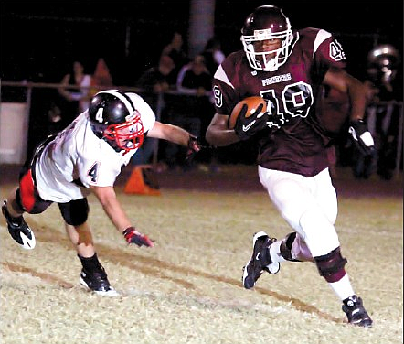 Gentry senior Tre Ascencio-Porter runs the ball around a Pea Ridge defender and down the field for a big gain for the Pioneers on Friday night