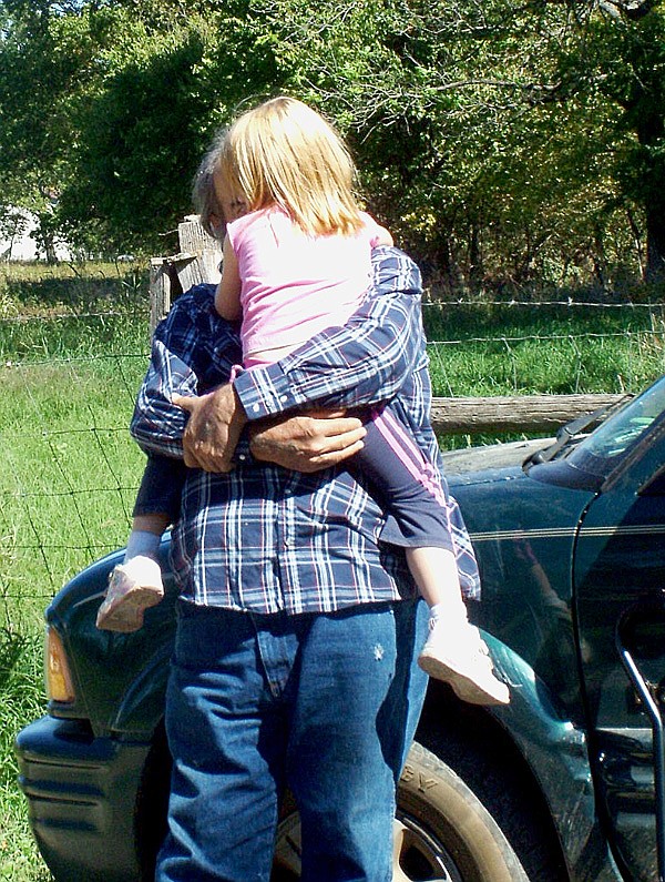 Katherine Elizabeth Reeves, 4, was hugged by her grandfather after being found and returned to her family.