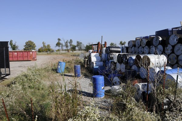 The site of the former Haz-Mert waste management company, seen Wednesday in Rogers, is being cleaned up by the state of various material including batteries, paint, pesticides and one ounce of uranium nitrate. Waste Services of Little Rock is performing the cleanup with a completion date of Friday.
