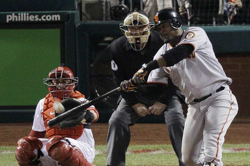 San Francisco’s Juan Uribe put the Giants in the World Series with a first-pitch, eighth-inning home run that sealed a 3-2 victory over two-time defending National League champion Philadelphia. 