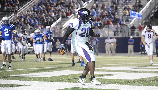 Fayetteville senior tight end Demetrius Dean walks into the end zone through the Rogers defense during the first quarter of play Friday in Rogers. Go to nwaonline.com/photoreprints to see more photos.
