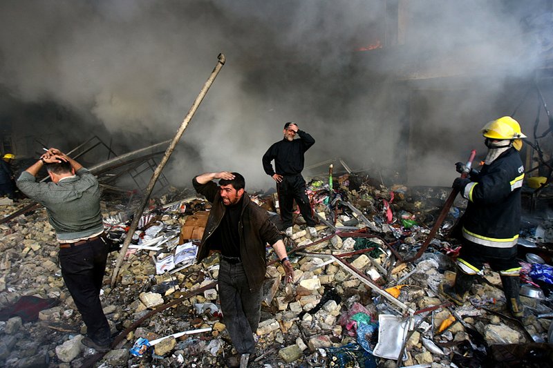 Iraqis grieve amid the rubble after a double car-bomb attack in Baghdad on Feb. 12, 2007. Files released by the WikiLeaks website reported that the Iraqi death toll from sectarian and criminal violence was much higher than previously acknowledged. 