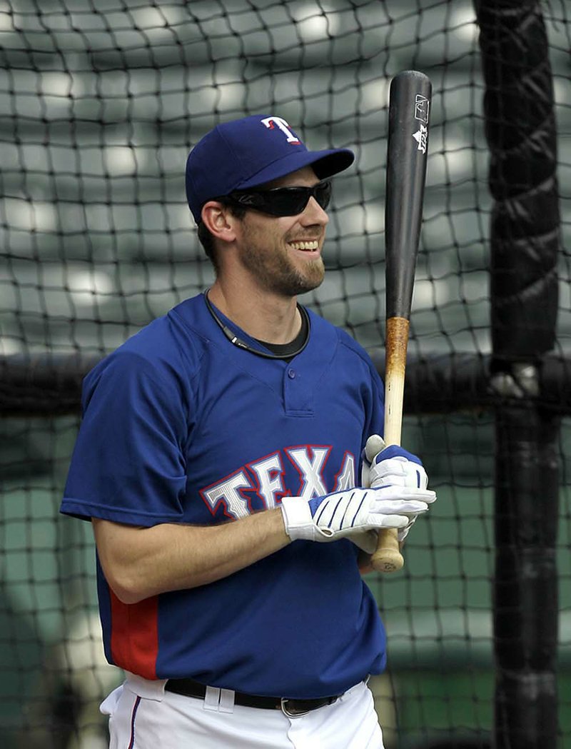 Texas Rangers starting pitcher Cliff Lee smiles after taking batting practice Sunday in Arlington, Texas. 
