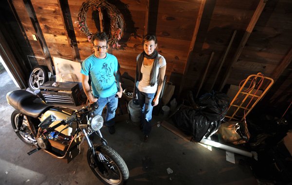 Newly married couple Julian and Lori Santa-Rita of Fayetteville have worked to convert an old Honda motorcycle to electric power.