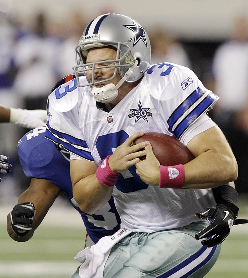 Dallas Cowboys quarterback Jon Kitna is sacked by New York Giants safety Deon Grant during the second quarter of Monday’s game in Arlington, Texas.