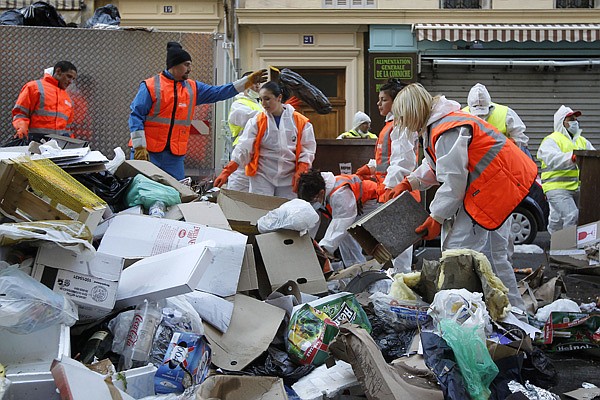 Garbage collectors began tackling Marseille's reeking mounds of trash in the center of Marseille, southern France, Tuesday, Oct. 26, 2010. Striking garbage collectors in Marseille faced 9,000 tons of garbage that have piled up in the streets in the last two weeks. The FO union voted Monday evening to end the protest out of concerns over "hygiene and safety." City authorities said it would take four to five days before France's second-largest city starts looking, and smelling, like itself. 