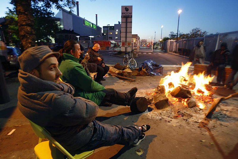 Striking employees block the main entrance of a waste-incineration plant in Ivry-sur-Seine, near Paris, on Monday. 