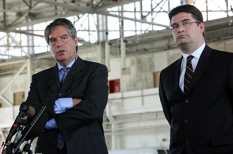 Defense attorneys Dennis Edney and Nathan Whitling talk to reporters Monday at the U.S. naval base in Guantanamo Bay, Cuba, after their client, Omar Khadr, pleaded guilty to war crimes. 