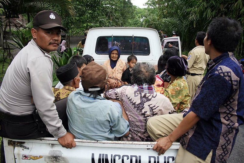 Villagers board a truck Monday to evacuate their homes on the slope of Mount Merapi in Yogyakarta, Indonesia. 