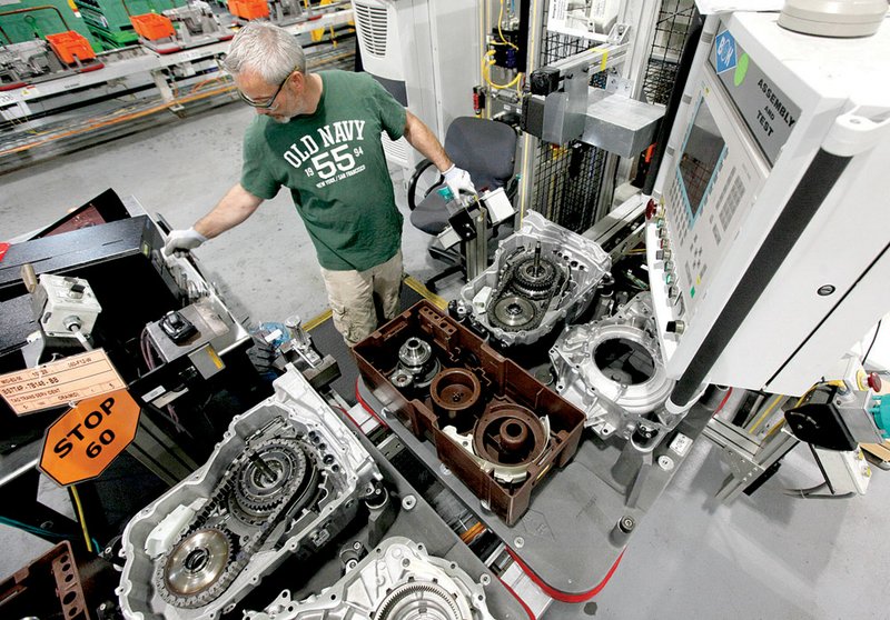 Matthew Brown assembles a six speed transmission at the Ford Motor Company Van Dyke Transmission Plant in Sterling Heights, Mich., Monday, Oct. 25, 2010. The most problem-free cars and trucks still are made by Honda and Toyota, but Ford is closing in fast and General Motors is making big quality improvements, according to Consumer Reports magazine's 2010 rankings.