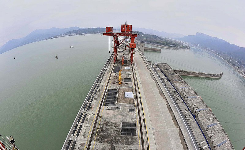 Water fills the reservoir (left) of the Three Gorges Dam in Hubei Province on Tuesday in this photo released by China’s Xinhua News Agency.

 
