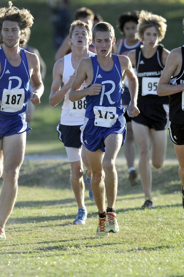 Rogers High’s Phillip Freeman, center, and Drew Storment race in the 7A-West Conference Boys Cross Country Meet on Tuesday at Agri Park in Fayetteville. Freeman finished fifth with a time of 16 minutes, 45.6 seconds while Storment was seventh in 17 minutes, 3.4 seconds.