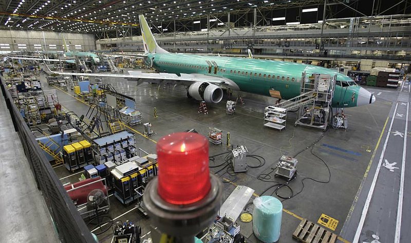 A flashing red light indicates that electrical power is connected to a Boeing 737 being assembled Tuesday at the company’s plant in Renton, Wash. 