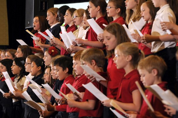 Members of the St. Joseph Catholic School’s “Angel Choir” sing a selection of songs for the Global Leadership Conference on Wednesday at the Holiday Inn in Springdale. The event featured local and national speakers promoting the idea of how leadership can make a child’s life better.