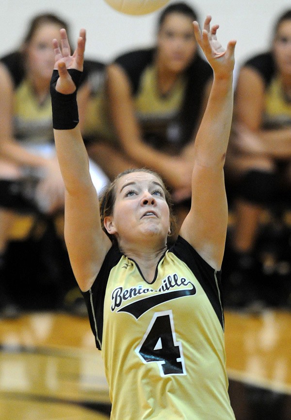 Bentonville’s Morgan Hayes sets the ball Wednesday during the Lady Tigers’ win against Bryant in the Class 7A State Volleyball Tournament in Tiger Arena in Bentonville.