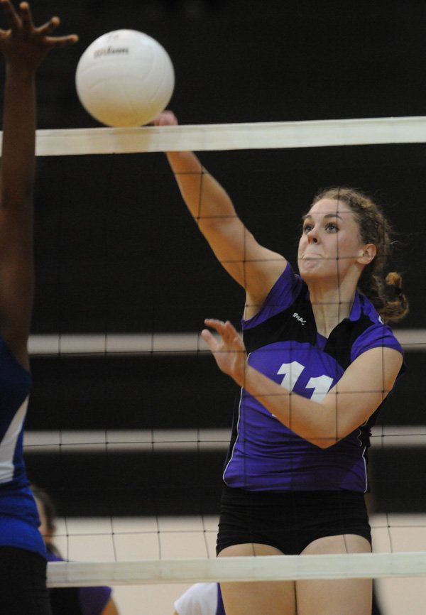 ayetteville’s Courtney Marshall spikes the ball on Oct. 27 against North Little Rock in the Class 7A State Volleyball Tournament at Bentonville.