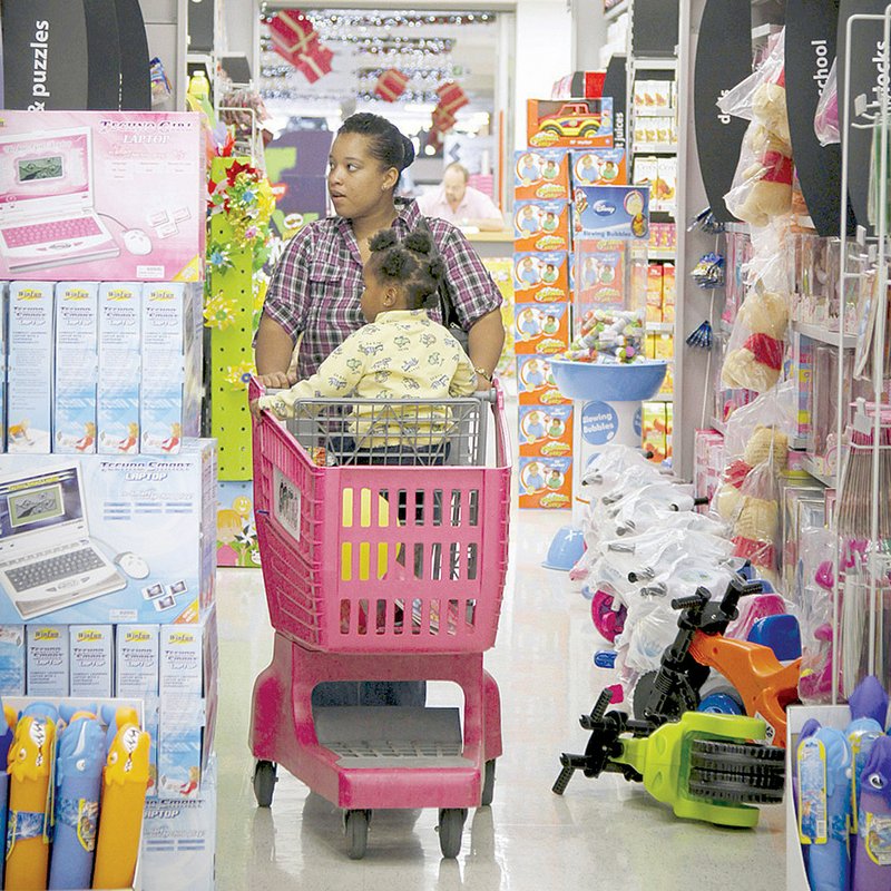 A customer shops Thursday at a Game supermarket, part of Massmart Holdings Limited in Johannesburg. 