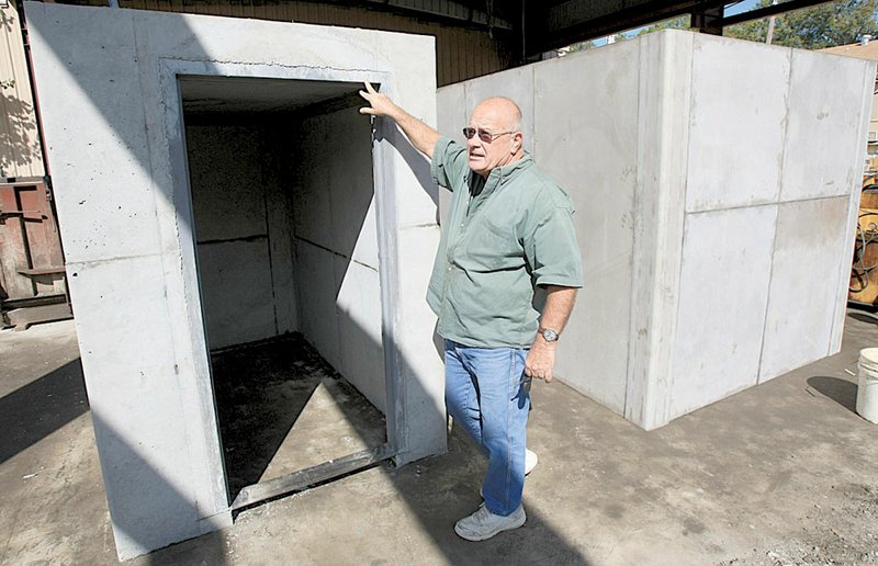 Jerry Kuykendall, general manager of Kuykendall Cement Corp. in Gravel Ridge, shows off the concrete safe rooms the company makes. The rooms must be installed during home construction.