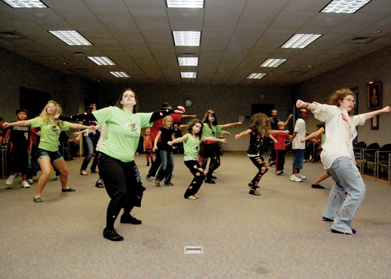 Local dance studios perform a 'Thriller' routine.