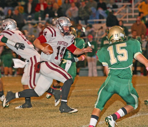 Siloam Springs quarterback Braden Pippin of Siloam Springs breaks into the open against Alma for a first down Friday in Alma.