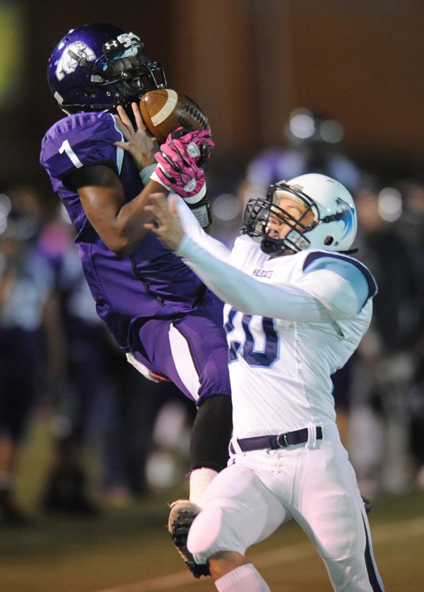 Fayetteville senior receiver Chris Smith is unable to secure the ball while attempting to make a catch as Springdale Har-Ber senior cornerback Ryan Miller collides with him during the second quarter Friday at Harmon Field in Fayetteville. Go to nwaonline.com/photoreprints to see more photos.