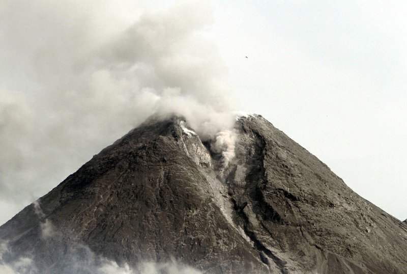 Mount Merapi spews volcanic smoke as seen from Cangkringan, Yogyakarta, Indonesia, Saturday, Oct. 30, 2010. 