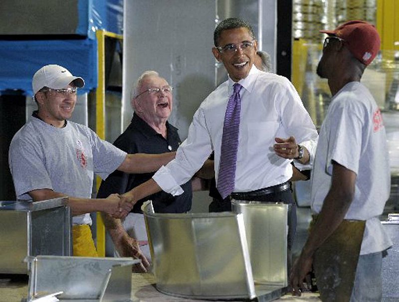 President Barack Obama meets Friday with employees at Stromberg Metal Works during a tour of the company in Beltsville, Md. He later campaigned in Virginia for U.S. Rep. Tom Perriello. 